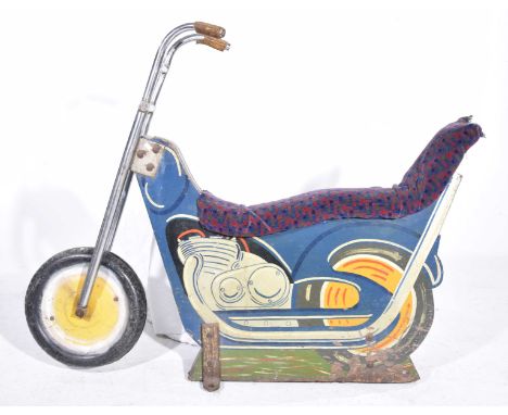 A vintage mid 20th Century fairground motorcycleThe chopper motorcycle with plush extended seat and extended raised handle ba