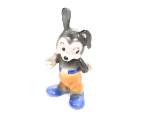 A vintage 1950's Hummel Goebel Mickey Mouse figurine
Pained in black, blue and yellow colours with factory mark to base stamp