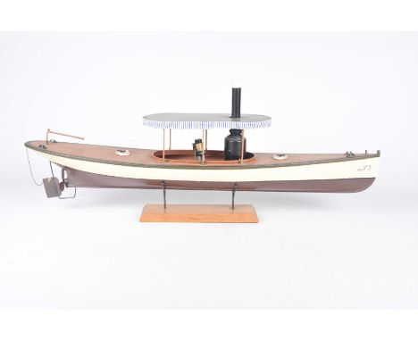 A wooden model steamboat 
The wooden painted hull delicately detailed with further painted wooden fittings, and adorned with 
