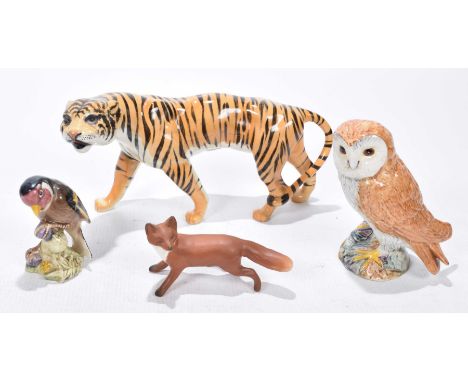 A small group of Beswick itemsTo include Tiger, model no: 1486, 11cm high, Beswick Barn Owl, model no: 1046, Gold Finch model