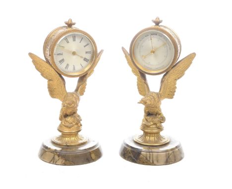An early 20th Century French ovolo mantle clockSupported on eagle pedestal and circular marble plinth base together with matc