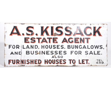 A vintage enamel signThe elongated rectangular sign with text "A.S. Kissack, Estate Agent for Land, Houses, Bungalows and Bus
