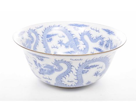 A Chinese style blue and white punch bowl, 20th CenturyThe 'U' shaped bowl, adorned in under glazed cobalt depicting two drag