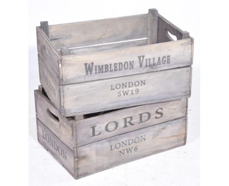 Two vintage apple cratesEach of typical panelled form with twin handles and stencil to the exterior Wimbledon Village, London