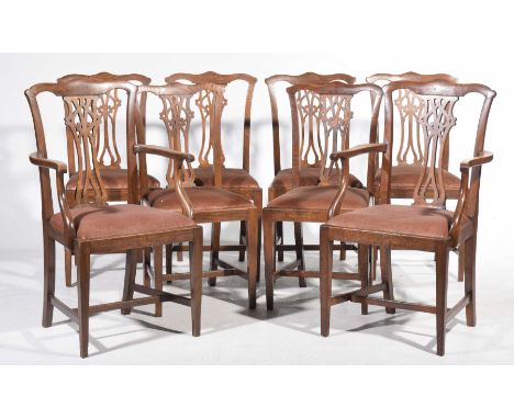 A set of eight oak Chippendale style dining chairs, early 20th CenturyEach chair with a Cupid's bow top rail above an openwor