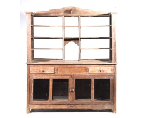 A stripped rustic hardwood shop counter/display cabinetThe super structure back with a stepped architectural pediment above a