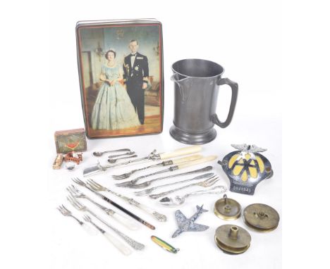 A mixed group of collectablesComprising a 19th Century pewter court jug together with brass clock pulleys, vintage AA badge, 