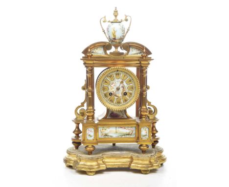 A late 19th Century French gilt metal porcelain and enamel decorated mantle clockWith elaborate architectural form, the body 