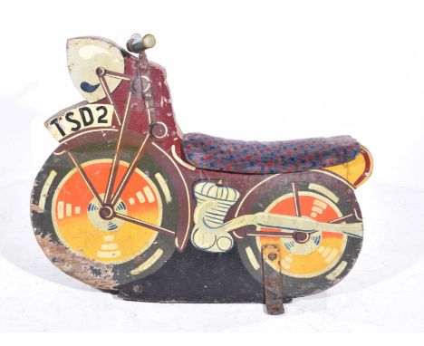 A vintage mid 20th Century fairground wooden motorcycleThe carved and painted model bike with plush seat and applied metal ha