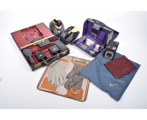 A collection of vintage gentleman's travelling itemsTo include a black cased travelling set comprising cologne bottles, brush