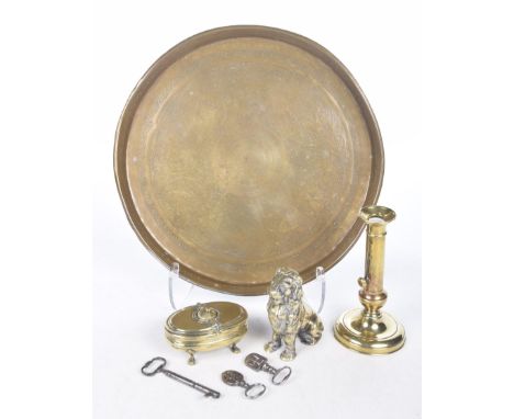 A mixed group of collectablesComprising a 19th Century brass candlestick, 19th brass travelling inkwell, brass lion shaped mo