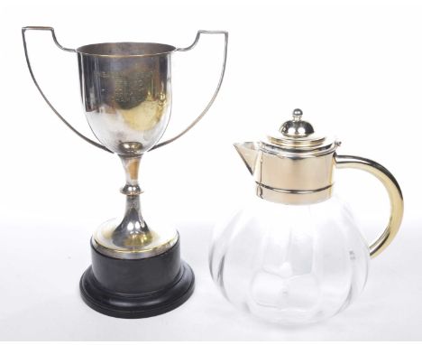 A vintage metal and glass lemonade/water jugThe bulbous jug with glass insert and loop handle, together with a darts competit