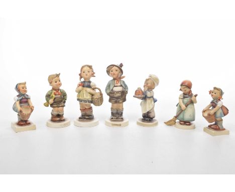 A collection of Hummel Goebel figuresTo include seven examples of varying size depicting children in Bavarian dress carrying 