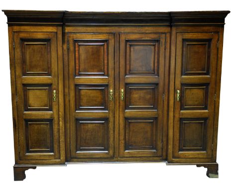 A super quality George III inverted breakfront upper housekeepers cupboard With a moulded cornice above a mahogany crossbande