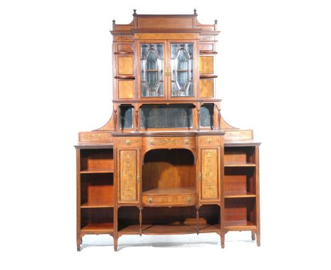 An Edwardian inlaid mahogany chiffonier The high back with urn shaped finials above a dentil cornice and a frieze inlaid with