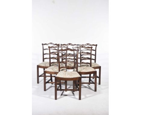 A set of six mahogany Chippendale style dining chairs. early 20th CenturyEach chair with a pierced wavy rail back above a dro