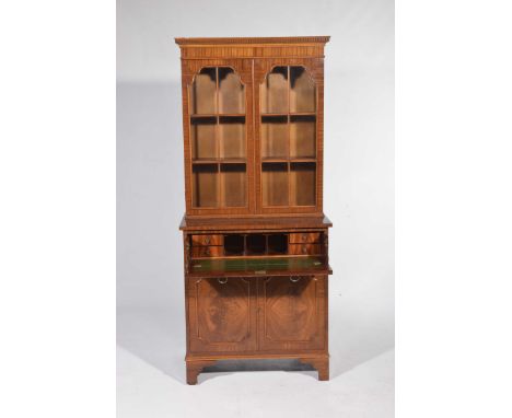 A good quality Regency style mahogany secretaire bookcaseHaving a dentil cornice above a pair of astragal glazed doors enclos