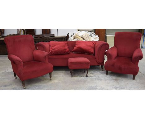 An early 20th Century red velour drop-end Chesterfield type sofaWith a deep set scroll arm raised upon legs of tapering squar