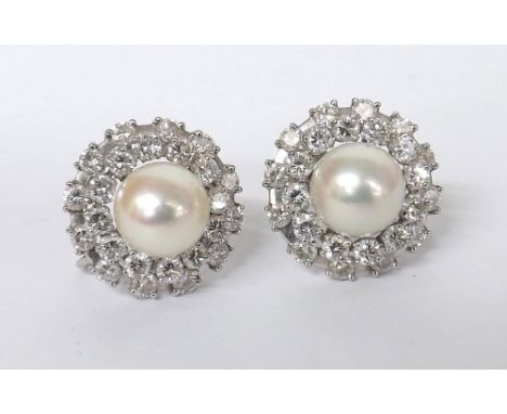 Pair of attractive two tier diamond and cultured pearl circular cluster earrings, with round brilliant-cut diamonds set in wh