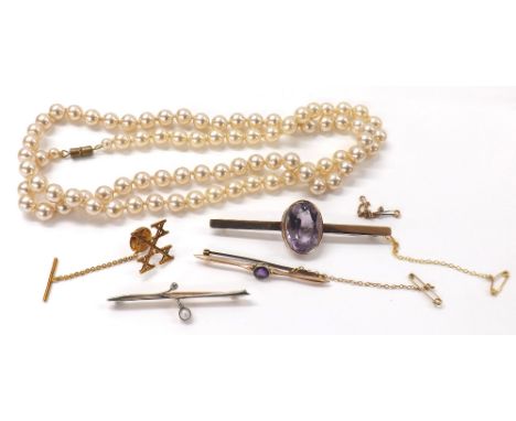 Three gold brooches including a diamond and pearl example, each with safety chains, 15.8gm; also a plated tie-pin and faux pe