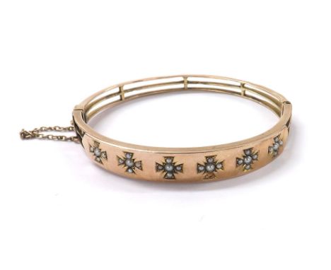 Edwardian 9ct seed pearl hinged bangle set with six Maltese Cross emblems, safety chain, band width 10mm, 13.2gm  