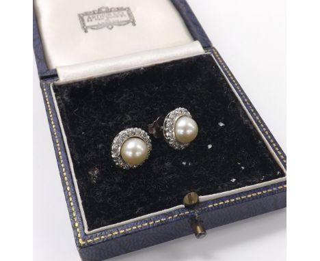 Pair of cultured pearl and diamond circular earrings in white metal, the pearls 8mm, 6gm, 13mm diameter; box 