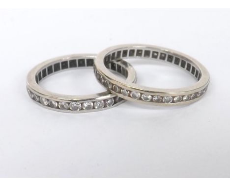 Two platinum diamond full eternity rings, each with round brilliant-cuts, 7.7gm, band width 3.5mm, ring sizes N and P/Q (2)  