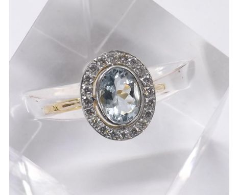 18ct oval aquamarine and diamond cluster ring, the aquamarine 1.50ct approx in a round brilliant-cut surround, cluster 13mm x