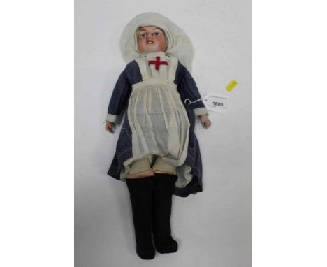 Early 20th century Continental bisque headed porcelain doll dressed as a First World War nurse. Bisques shoulders marked G9, 