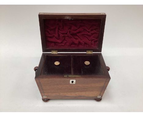 William IV rosewood tea caddy, of sarcophagus form, with mother of pearl inlay, two division interior and turned bone knobs, 
