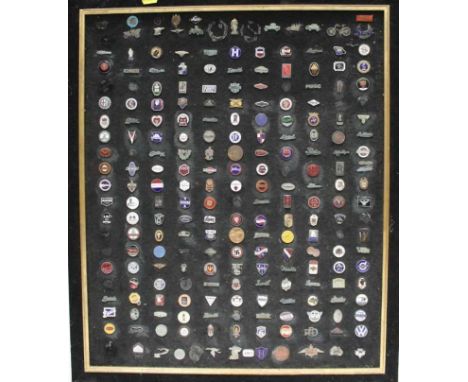 Display board mounted with approximately 200 enamel car badges, 66 x 56cm