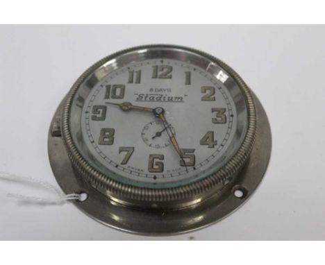 1930s 'Stadium' car clock with Swiss 8 day movement, silvered dial with luminous painted hands and hour markers.