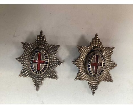 Pair of early 20th century Coldstream guards white metal and enamel collar badges / brooches