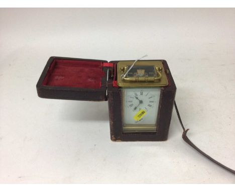 Good brass carriage clock, the enamel dial with Roman and Arabic numerals, secondary alarm dial, bevelled glass, 12cm high, i
