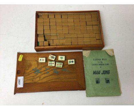 Vintage mah jong set with bone and bamboo counters, with instructions in wooden box