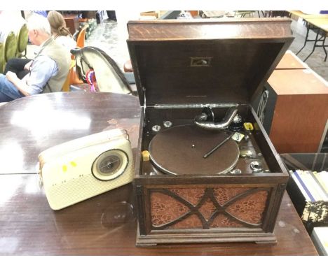 Vintage HMV gramophone in wooden case, together with a Bush TR 82D radio (2)Working order, looks to be in good condition