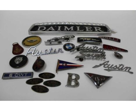 Collection of 1950s and later car badges to include Jowett Javelin, Jaguar and others, together with a Daimler commercial veh