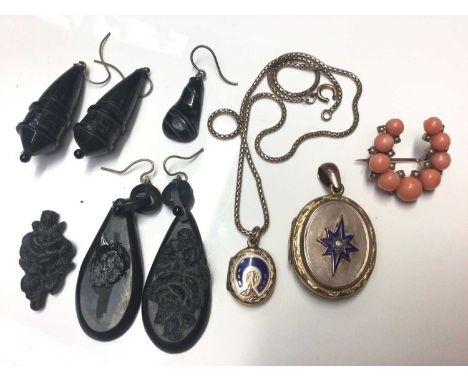 Victorian coral and seed pearl horseshoe shaped brooch, two antique mourning lockets with enamel decoration and a small selec