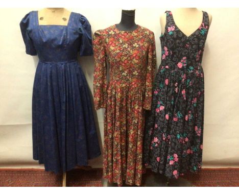 Laura Ashley - four 1980s and 90s dresses including sun dress with matching jacket and black velvet evening dress. Sold with 