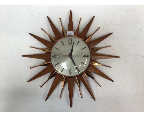 Metamec copper and wood sunburst clock, 45cm wide