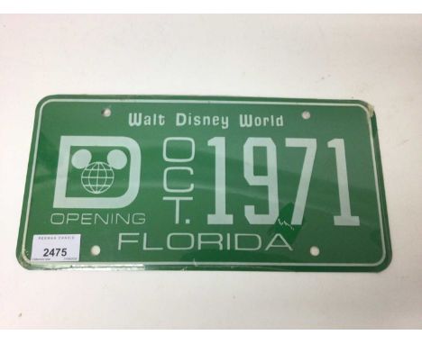 Rare Walt Disney memorabilia - a Walt Disney World license plate with the opening date Oct 1971, still in original wrapping, 