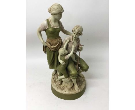 Royal Dux group of a farmhand with wife and child, marks to base, 56cm highThe pink triangle is unglazed and marked Bohemia, 