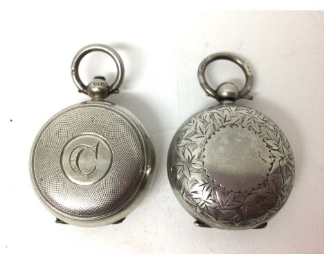 Two silver sovereign cases, one floral engraved, the other engine turned (2)