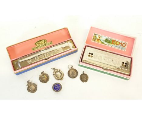 THREE SILVER PENDANT MEDALLIONS RELATING TO "SERVICE TO BRASS BANDS" TWO OTHERS SIMILAR and a SILVER AND BLUE ENAMEL LAPEL BA