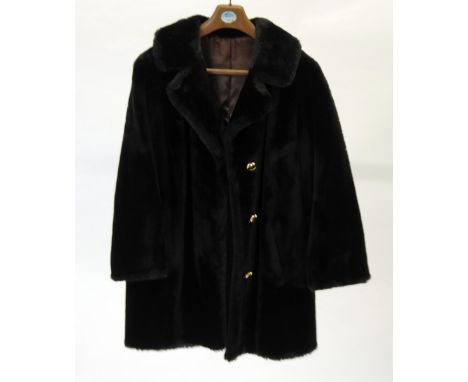 A LADY'S BLACK BEAVER LAMB 3/4 LENGTH COAT with revered collar, three button front, half belted back 