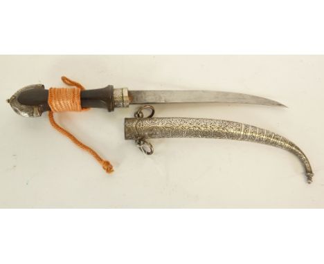 MIDDLE EASTERN JAMBIYA WITH CURVED DOUBLE EDGE BLADE, waisted hardwood hilt with foliate scroll embossed horseshoe shaped top