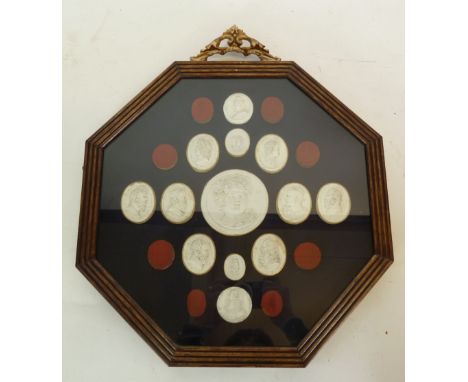 TWO DISPLAYS EACH COMPRISING THIRTEEN NINETEENTH CENTURY PLASTER BAS RELIEF PORTRAIT MEDALLIONS, or classical figure medallio
