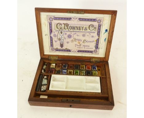 G ROWNEY & CO ARTISTS MAHOGANY WATER COLOUR PAINT BOX containing selection of paints and removable ceramic mixing tray/palett