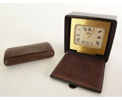 NINETEENTH CENTURY WOODEN OBLONG SNUFF BOX, with hinged lid, AND AN ANGELUS SWISS TRAVELLING ALARM CLOCK, in rectangular gilt