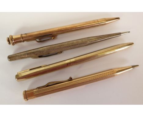 ENGINE TURNED STERLING SILVER CASED RETRACTABLE PENCIL AND THREE OTHERS in rolled gold (4) 